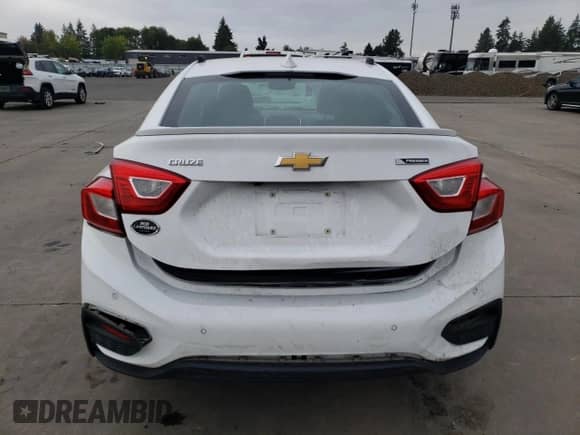 2018 Chevrolet Cruze Premier z VIN 1G1BF5SM5J7144326, wystawiony jako Copart lot #85756815 z przebiegiem 59 232 mil mil oraz Szkoda całkowita • Salvage title. Historia ofert i sprzedaży dostępna na DreamBid. Obrazek 6.