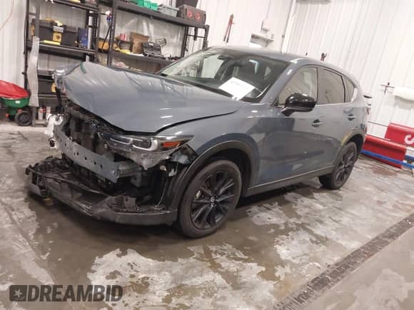 2022 Mazda CX-5 S Preferred z VIN JM3KFBCM0N1585446, wystawiony jako IAAI lot #42393723 z przebiegiem 70 131 mil mil oraz . Historia ofert i sprzedaży dostępna na DreamBid. Obrazek 2.