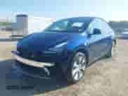 2023 Tesla Model Y Long Range with VIN 7SAYGDEE4PA125024, listed as a IAAI auction lot 43252218 with 21,200 mi miles and . Bid and sale history available at DreamBid. Image 2.