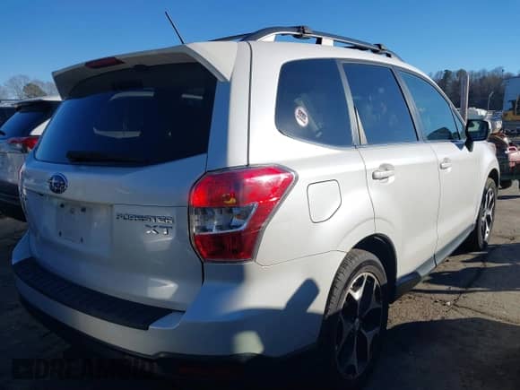 2014 Subaru Forester XT Touring z VIN JF2SJGPC9EH417920, wystawiony jako IAAI lot #41270689 z przebiegiem 184 976 mil mil oraz . Historia ofert i sprzedaży dostępna na DreamBid. Obrazek 4.