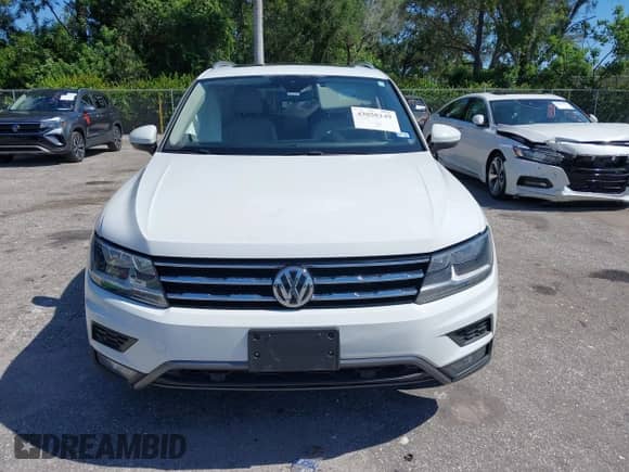 2021 Volkswagen Tiguan SE with VIN 3VV3B7AX2MM084659, listed as a IAAI auction lot 43050149 with 66,676 mi miles and . Bid and sale history available at DreamBid. Image 12.