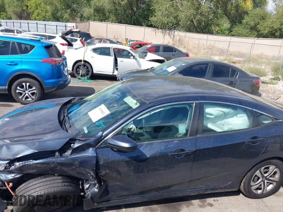 2016 Honda Civic LX with VIN 19XFC2F56GE246942, listed as a IAAI auction lot 43050802 with 99,087 mi miles and . Bid and sale history available at DreamBid. Image 14.