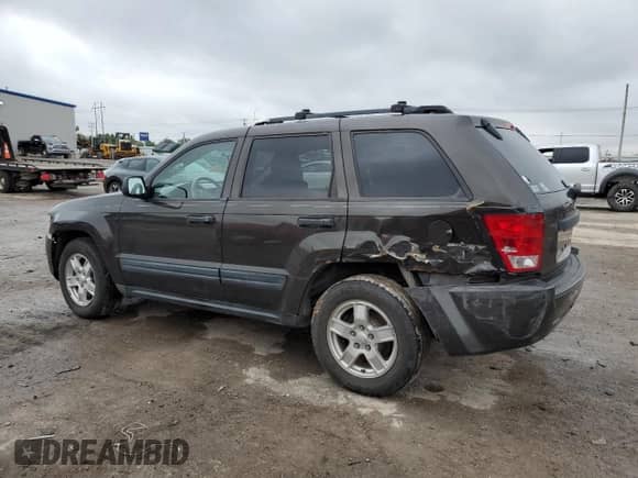 2005 Jeep Grand Cherokee Laredo with VIN 1J4GS48KX5C563594, listed as a Copart auction lot 69724645 with 189,716 mi miles and Salvage title. Bid and sale history available at DreamBid. Image 2.