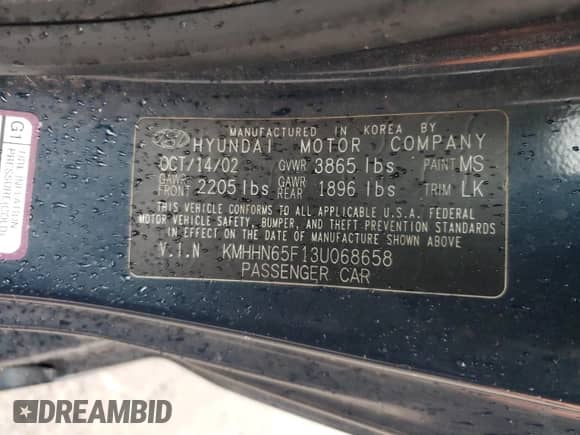 2003 Hyundai Tiburon GT with VIN KMHHN65F13U068658, listed as a Copart auction lot 81799404 with 163,148 mi miles and Salvage title. Bid and sale history available at DreamBid. Image 12.