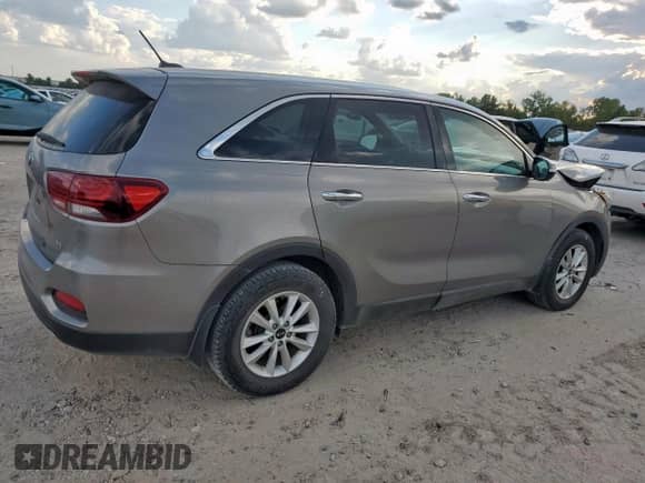 2019 Kia Sorento LX with VIN 5XYPG4A50KG496720, listed as a Copart auction lot 82379135 with 76,476 mi miles and Salvage title. Bid and sale history available at DreamBid. Image 3.