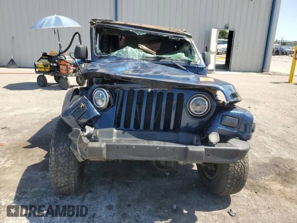 2003 Jeep Wrangler X z VIN 1J4FA39S43P357281, wystawiony jako Copart lot #67979335 z przebiegiem Nie podano mil oraz Szkoda całkowita • Salvage title. Historia ofert i sprzedaży dostępna na DreamBid. Obrazek 5.