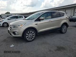 2017 Ford Escape Titanium с VIN 1FMCU9JDXHUC37599, выставлен на аукционе Copart как лот 69261175 с пробегом 110 175 миль миль и Списание • Salvage title. История ставок и продаж доступна на DreamBid. Изображение 1.
