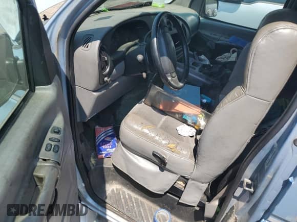 2000 Ford Econoline Cargo Recreational with VIN 1FDRE14L5YHA56690, listed as a Copart auction lot 58926155 with 162,797 mi miles and Salvage title. Bid and sale history available at DreamBid. Image 8.