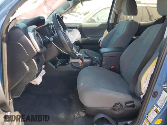2019 Toyota Tacoma SR with VIN 3TMCZ5AN3KM244008, listed as a Copart auction lot 68974465 with 123,236 mi miles and Salvage title. Bid and sale history available at DreamBid. Image 7.