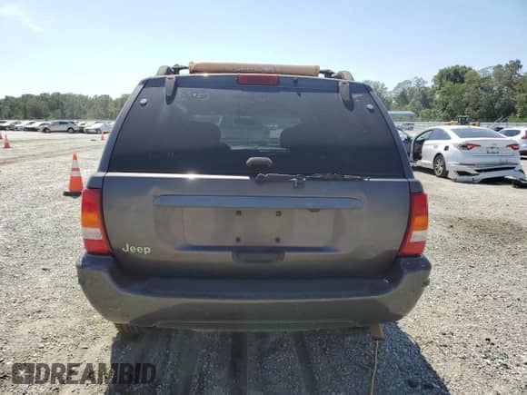 2004 Jeep Grand Cherokee Laredo with VIN 1J4GX48S94C381627, listed as a Copart auction lot 70754855 with 318,672 mi miles and Salvage title. Bid and sale history available at DreamBid. Image 6.