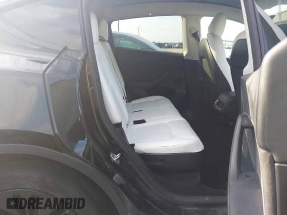 2023 Tesla Model Y Long Range z VIN 7SAYGAEE7PF767951, wystawiony jako IAAI lot #43128878 z przebiegiem 36 431 mil mil oraz . Historia ofert i sprzedaży dostępna na DreamBid. Obrazek 8.