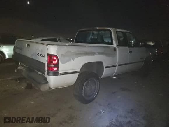 1996 Dodge 1500 with VIN 3B7HF13Y7TG127854, listed as a Copart auction lot 83703544 with 197,430 mi miles and Salvage title. Bid and sale history available at DreamBid. Image 3.