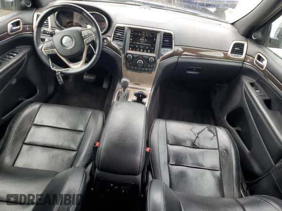 2017 Jeep Grand Cherokee Overland with VIN 1C4RJECG5HC605538, listed as a Copart auction lot 81946415 with 100,658 mi miles and Salvage title. Bid and sale history available at DreamBid. Image 8.