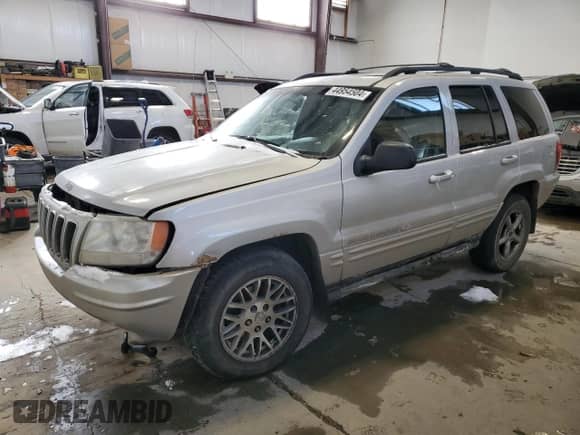 2003 Jeep Grand Cherokee Overland с VIN 1J8GW68J63C616424, выставлен на аукционе Copart как лот 69949265 с пробегом Не указан миль и Списание • Salvage title. История ставок и продаж доступна на DreamBid. Изображение 1.