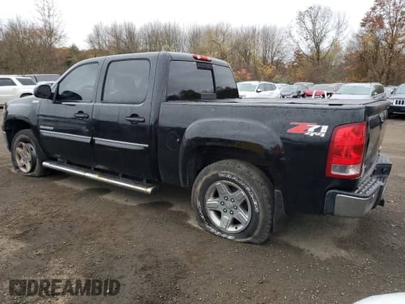 2011 GMC Sierra 1500 SLT with VIN 3GTP2WE38BG107228, listed as a Copart auction lot 90619085 with 233,578 mi miles and Clean title. Bid and sale history available at DreamBid. Image 2.