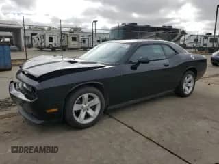2013 Dodge Challenger SXT with VIN 2C3CDYAG5DH660133, listed as a Copart auction lot 82235645 with 107,600 mi miles and Salvage title. Bid and sale history available at DreamBid. Image 1.