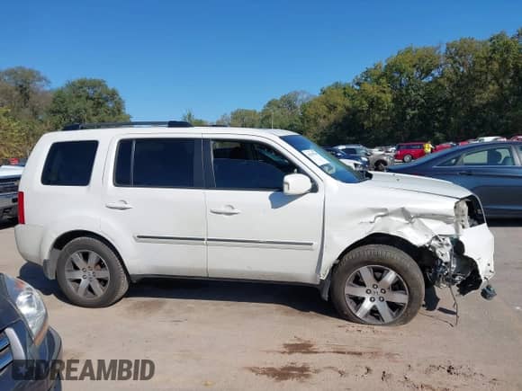 2012 Honda Pilot Touring with VIN 5FNYF3H90CB024228, listed as a IAAI auction lot 43395780 with 276,515 mi miles and . Bid and sale history available at DreamBid. Image 14.