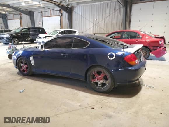 2003 Hyundai Tiburon GT с VIN KMHHN65F43U075197, выставлен на аукционе Copart как лот 52617655 с пробегом 117 561 миль миль и Списание • Salvage title. История ставок и продаж доступна на DreamBid. Изображение 2.