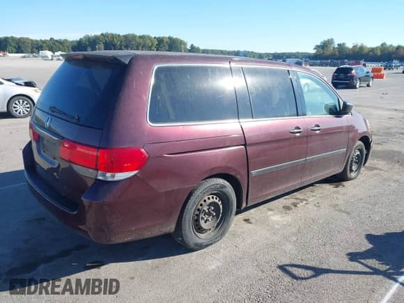 2010 Honda Odyssey LX with VIN 5FNRL3H25AB079528, listed as a IAAI auction lot 43390658 with 242,152 mi miles and . Bid and sale history available at DreamBid. Image 4.