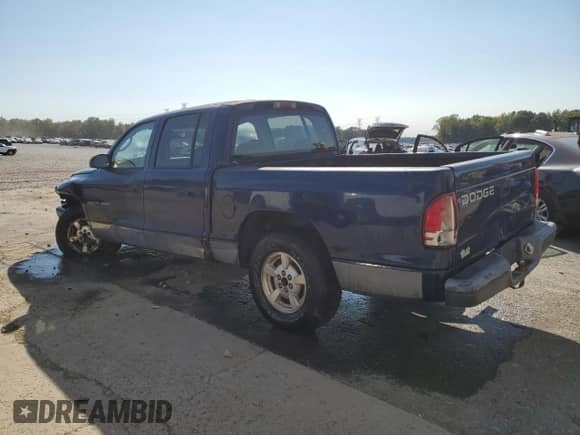 2002 Dodge Dakota Sport с VIN 1B7HL38X42S589588, выставлен на аукционе Copart как лот 75025304 с пробегом 262 560 миль миль и Списание • Salvage title. История ставок и продаж доступна на DreamBid. Изображение 2.
