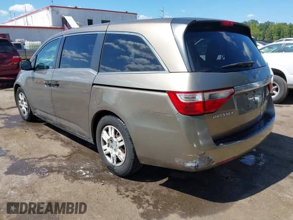 2012 Honda Odyssey LX z VIN 5FNRL5H25CB107665, wystawiony jako IAAI lot #43049375 z przebiegiem 125 129 mil mil oraz . Historia ofert i sprzedaży dostępna na DreamBid. Obrazek 3.