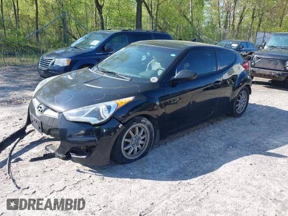 2013 Hyundai Veloster w/Black Int z VIN KMHTC6AD2DU150873, wystawiony jako IAAI lot #42234776 z przebiegiem 192 117 mil mil oraz . Historia ofert i sprzedaży dostępna na DreamBid. Obrazek 2.
