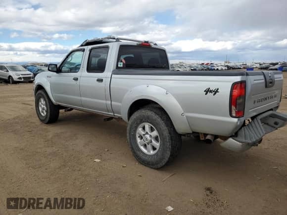 2003 Nissan Frontier SVE with VIN 1N6MD29Y83C457312, listed as a Copart auction lot 79390474 with 119,904 mi miles and Salvage title. Bid and sale history available at DreamBid. Image 2.