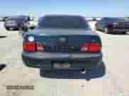 1995 Toyota Camry LE z VIN 4T1SK12E1SU572333, wystawiony jako Copart lot #80828565 z przebiegiem 151 689 mil mil oraz Szkoda całkowita • Salvage title. Historia ofert i sprzedaży dostępna na DreamBid. Obrazek 6.