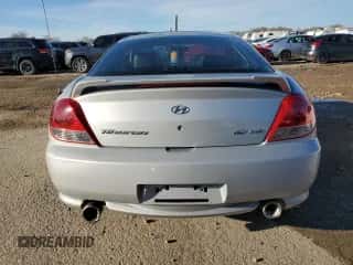 2006 Hyundai Tiburon GT с VIN KMHHN65F26U209337, выставлен на аукционе Copart как лот 85268614 с пробегом 110 955 миль миль и Списание • Salvage title. История ставок и продаж доступна на DreamBid. Изображение 6.