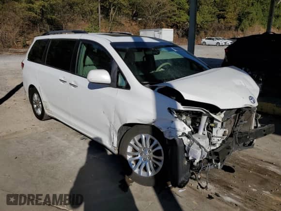 2011 Toyota Sienna XLE with VIN 5TDYK3DC1BS056810, listed as a Copart auction lot 82490085 with 202,063 mi miles and Salvage title. Bid and sale history available at DreamBid. Image 4.