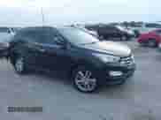 2014 Hyundai Santa Fe with VIN 5XYZU3LA5EG227817, listed as a IAAI auction lot 43073735 with 92,029 mi miles and . Bid and sale history available at DreamBid. Image 1.