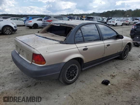 1999 Saturn SL с VIN 1G8ZH5280XZ178863, выставлен на аукционе Copart как лот 73660474 с пробегом 195 738 миль миль и Списание • Salvage title. История ставок и продаж доступна на DreamBid. Изображение 3.