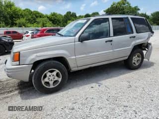1998 Jeep Grand Cherokee with VIN 1J4GX48Y0WC280564, listed as a Copart auction lot 64768885 with 190,664 mi miles and Salvage title. Bid and sale history available at DreamBid. Image 1.