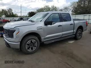 2023 Ford F-150 Lightning Pro with VIN 1FTVW1ELXPWG58560, listed as a Copart auction lot 54323825 with 20,476 mi miles and Salvage title. Bid and sale history available at DreamBid. Image 1.