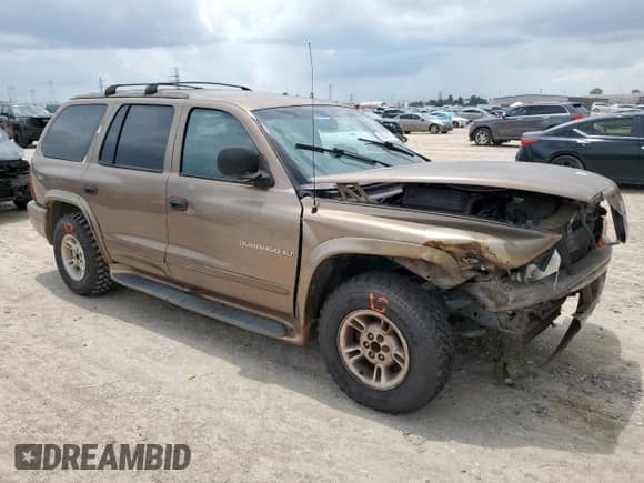 2000 Dodge Durango with VIN 1B4HR28Z7YF274244, listed as a Copart auction lot 60543055 with 140,717 mi miles and Salvage title. Bid and sale history available at DreamBid. Image 4.