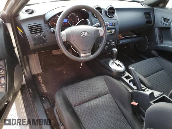 2007 Hyundai Tiburon GS with VIN KMHHM66DX7U246220, listed as a Copart auction lot 53555715 with 105,305 mi miles and Salvage title. Bid and sale history available at DreamBid. Image 8.