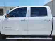 2015 Chevrolet Silverado 2500HD LTZ с VIN 1GC1KWEG3FF554288, выставлен на аукционе IAAI как лот 42889855 с пробегом 208 965 миль миль и . История ставок и продаж доступна на DreamBid. Изображение 14.
