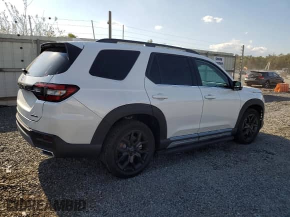 2025 Honda Pilot Touring с VIN 5FNYG1H76SB044787, выставлен на аукционе Copart как лот 80685445 с пробегом 4 493 миль миль и Списание • Salvage title. История ставок и продаж доступна на DreamBid. Изображение 3.