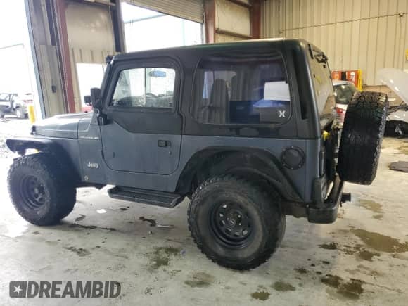 2001 Jeep Wrangler SE with VIN 1J4FA29P11P358326, listed as a Copart auction lot 56181715 with 201,929 mi miles and Clean title. Bid and sale history available at DreamBid. Image 2.