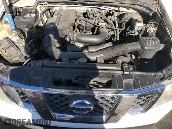 2012 Nissan Frontier S with VIN 1N6BD0CTXCC419881, listed as a Copart auction lot 86901364 with 154,243 mi miles and Salvage title. Bid and sale history available at DreamBid. Image 11.