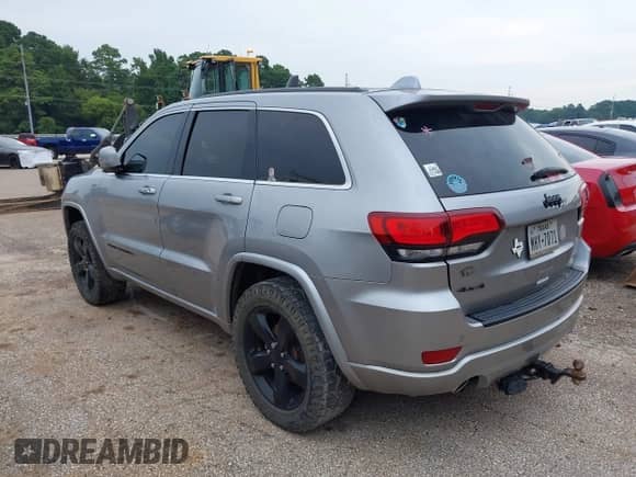 2015 Jeep Grand Cherokee Altitude z VIN 1C4RJFAG9FC164633, wystawiony jako IAAI lot #42732727 z przebiegiem Nie podano mil oraz . Historia ofert i sprzedaży dostępna na DreamBid. Obrazek 3.