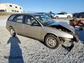 1999 Saturn SW z VIN 1G8ZK8277XZ162136, wystawiony jako Copart lot #83206604 z przebiegiem Nie podano mil oraz Szkoda całkowita • Salvage title. Historia ofert i sprzedaży dostępna na DreamBid. Obrazek 4.