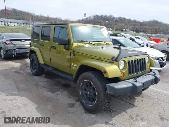 2007 Jeep Wrangler Unlimited Sahara z VIN 1J8GA59167L161894, wystawiony jako IAAI lot #41856064 z przebiegiem 122 714 mil mil oraz . Historia ofert i sprzedaży dostępna na DreamBid. Obrazek 1.