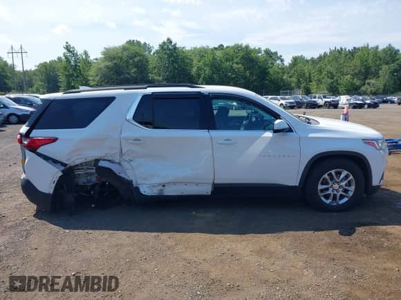 2019 Chevrolet Traverse LT Cloth z VIN 1GNEVGKW2KJ269249, wystawiony jako IAAI lot #42836941 z przebiegiem 74 886 mil mil oraz . Historia ofert i sprzedaży dostępna na DreamBid. Obrazek 13.