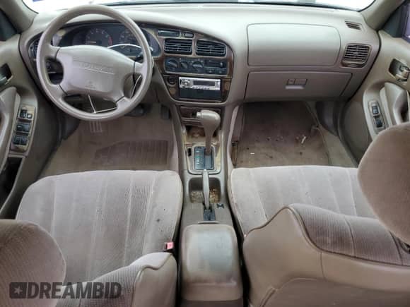 1996 Toyota Camry DX z VIN 4T1BG12K5TU768249, wystawiony jako Copart lot #46368865 z przebiegiem 196 226 mil mil oraz Czysty tytuł • Clean title. Historia ofert i sprzedaży dostępna na DreamBid. Obrazek 8.
