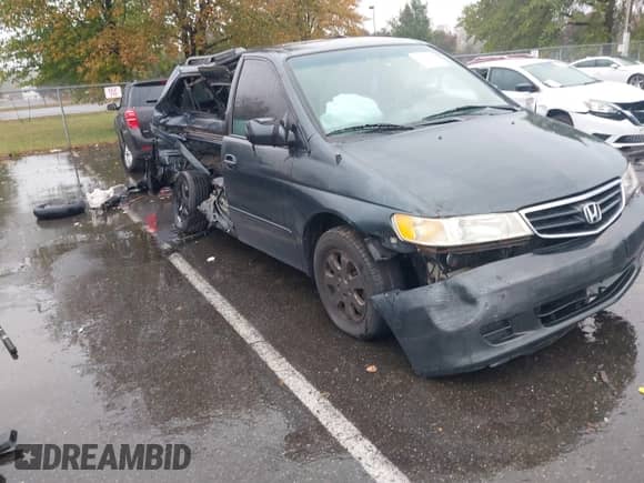 2003 Honda Odyssey EX z VIN 5FNRL18603B054627, wystawiony jako IAAI lot #43413800 z przebiegiem 201 434 mil mil oraz . Historia ofert i sprzedaży dostępna na DreamBid. Obrazek 6.