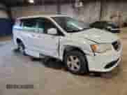2011 Dodge Grand Caravan Mainstreet with VIN 2D4RN3DG2BR626839, listed as a Copart auction lot 80804825 with 143,663 mi miles and Salvage title. Bid and sale history available at DreamBid. Image 4.