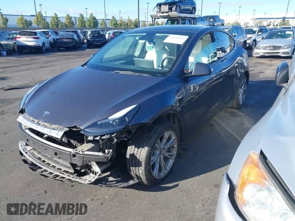 2023 Tesla Model Y Long Range with VIN 7SAYGAEE9PF662232, listed as a IAAI auction lot 43442303 with 42,636 mi miles and . Bid and sale history available at DreamBid. Image 2.