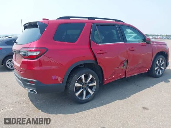 2023 Honda Pilot Elite with VIN 5FNYG1H83PB004800, listed as a IAAI auction lot 42883135 with 12,162 mi miles and . Bid and sale history available at DreamBid. Image 4.