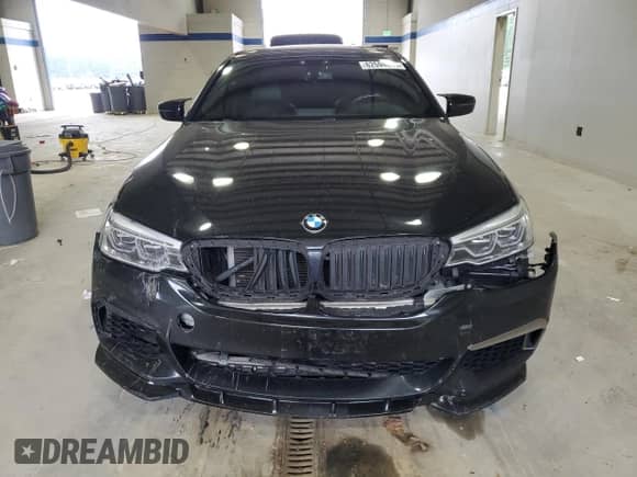 2018 BMW 5 Series M550i xDrive with VIN WBAJB9C54JB286660, listed as a Copart auction lot 62594805 with 137,794 mi miles and Salvage title. Bid and sale history available at DreamBid. Image 5.